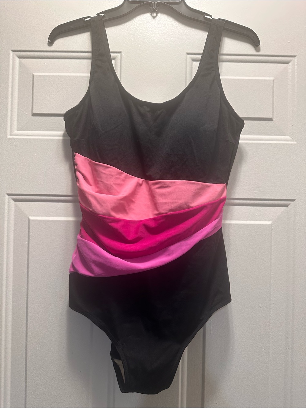 Sleek Black One-Piece Swimsuit with Pink Accent Bands